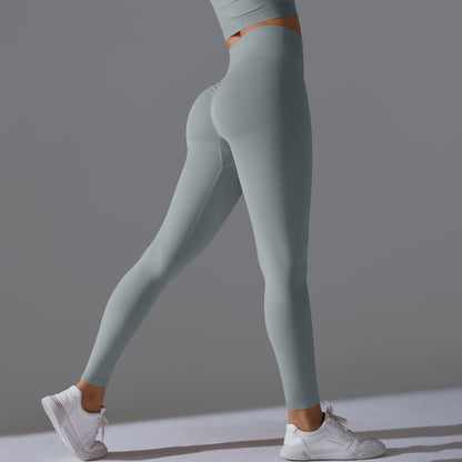 Seamless Solid Peach Sports Trousers for Women - Tight Running Fitness Yoga Pants with High Waist and Butt-Lifting Design