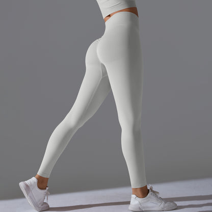 Seamless Solid Peach Sports Trousers for Women - Tight Running Fitness Yoga Pants with High Waist and Butt-Lifting Design